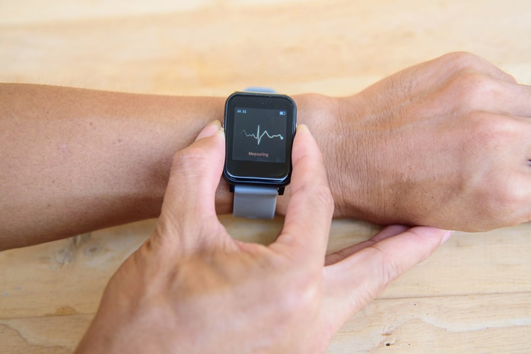 man checking heart on smartwatch